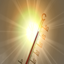 Illustration of a thermometer showing a high temperature, angled in front of a bright glowing sun with intense rays radiating outward. The thermometer scale ranges from 0 to 50 degrees, with the red column near 40 degrees, symbolizing extreme heat, hot weather, or a heat wave.